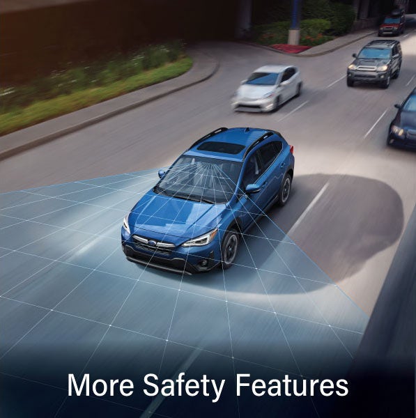 A Subaru Crosstrek in blue with the words “More Safety Features“. | Subaru of Grand Blanc in Grand Blanc MI